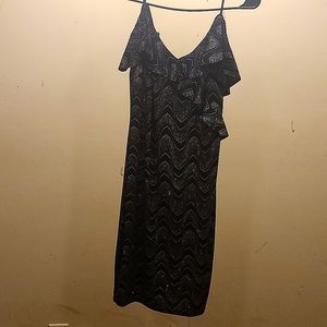 A mini black sparkly spaghetti strap dress size large but fits like a small.